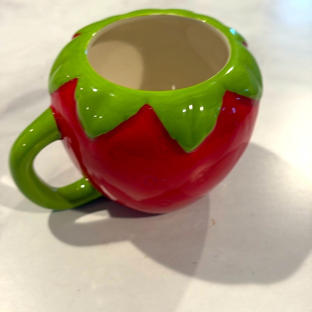 Strawberry mug earthenware microwave safe hand wash only great decor piece.